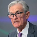Fed Holds Rates Steady, Signals Possible Cuts Later This Year