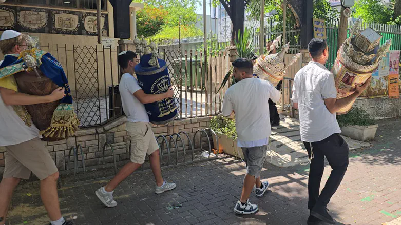 Holon: Torah scrolls rescued from synagogue hit in missile strike