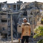 In Holon, Iranian missile strike reduces residential block to rubble