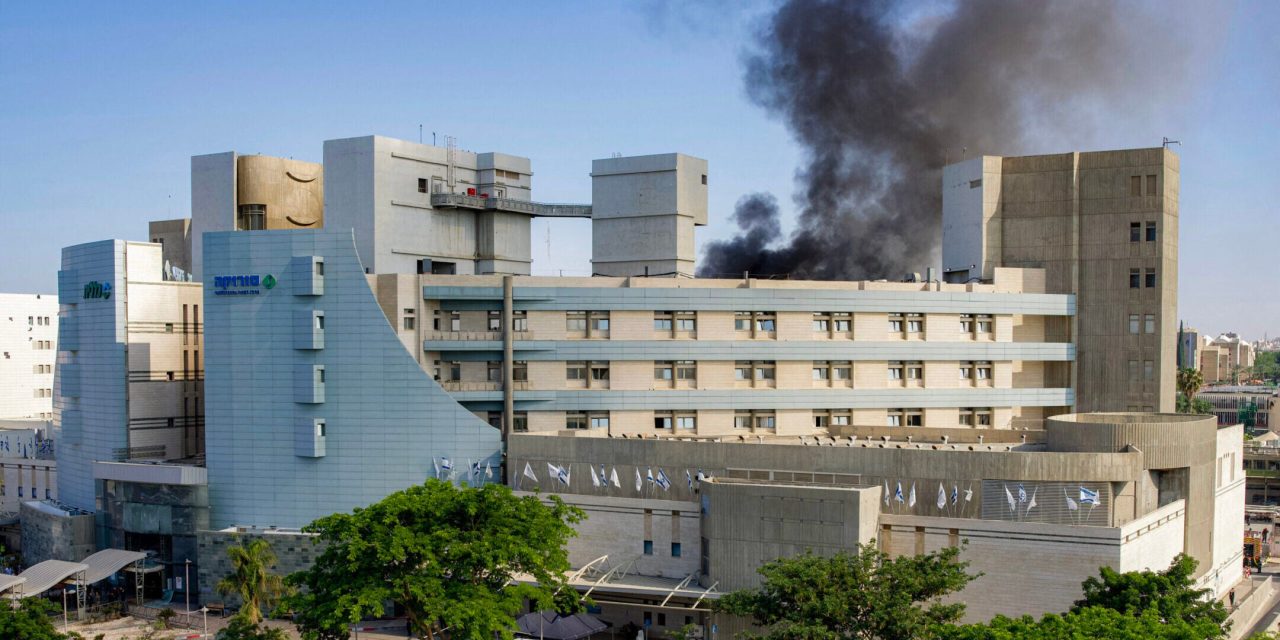 Iranian missile strikes Israeli hospital as Trump remains coy about whether US will intervene