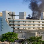 Iranian missile strikes Israeli hospital as Trump remains coy about whether US will intervene