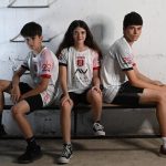 Hapoel fans model new uniforms, with Hersh logo, in bomb shelters