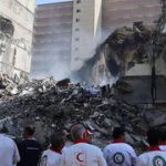 Israeli strikes reportedly trigger air defenses near Iran’s key port and nuclear sites