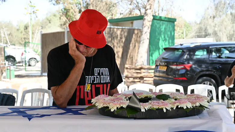 Gadi Mozes, captivity survivor, lays slain partner to rest in Nir Oz