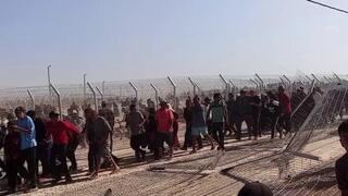 Israel faces claims of firing on civilians; reservist says mob tried to overrun aid corridor