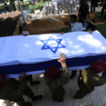 ‘You were in distress, and we didn’t know’: Hundreds attend funeral of lone soldier who died after suicide attempt