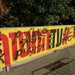 Banner calling for return of hostages in Tel Aviv defaced with anti-leftist graffiti