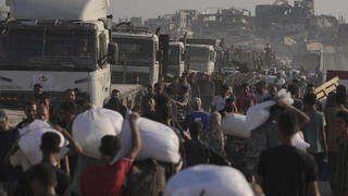 100+ NGOs accuse Israel of blocking Gaza aid; military liaison: Groups refused terror vetting