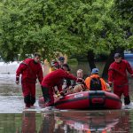 Hundreds of flights delayed and millions of Americans remain under flood alerts as torrential rain pounds Midwest