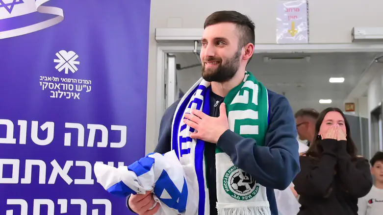 Captivity survivor Matan Angrest leaves the hospital accompanied by song and dance