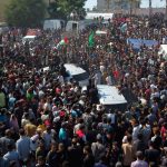 Palestinians cheer as freed prisoners begin to arrive under ceasefire deal 