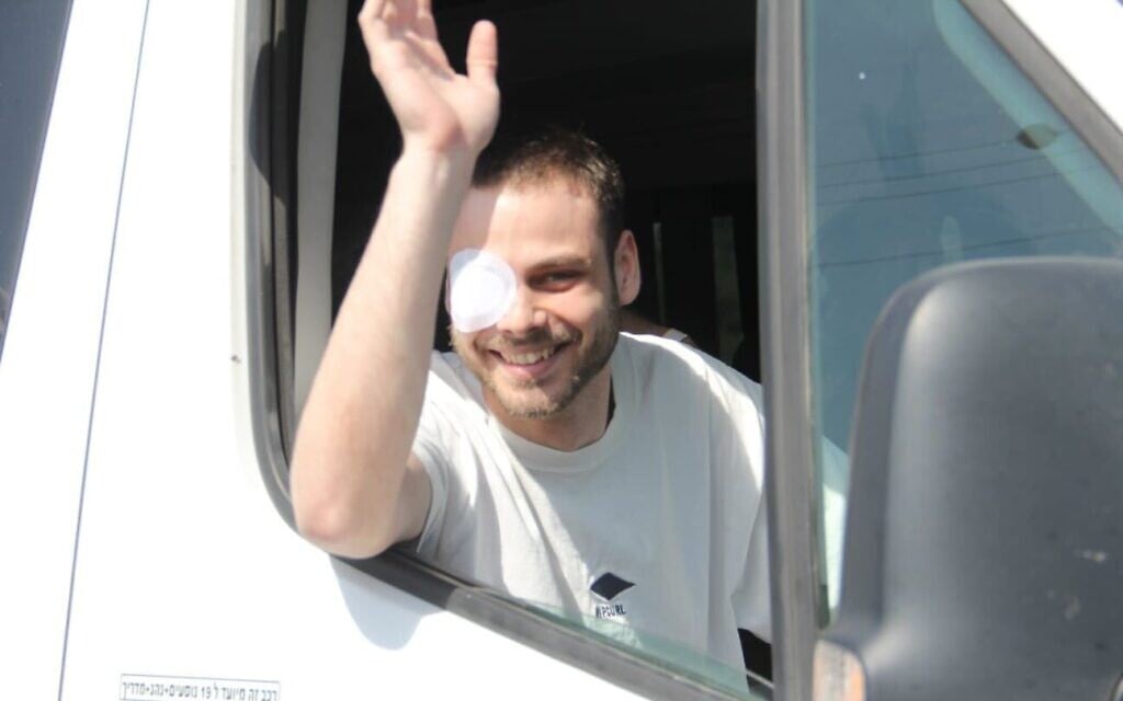 Released hostage Alon Ohel returns home to cheers by supporters
