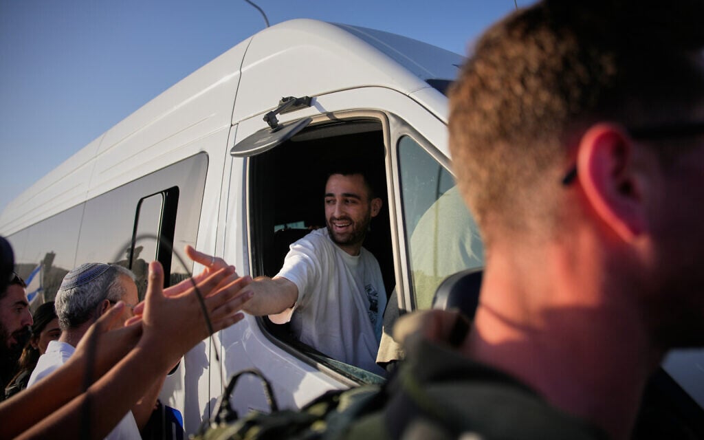 Freed hostage Avinatan Or leaves hospital, embraced by crowds along route home