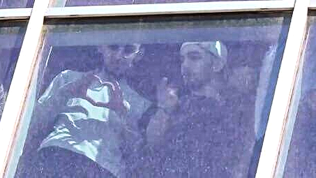 Freed Nova festival hostages wave 🫶 from Sheba Medical Center window as crowd cheers