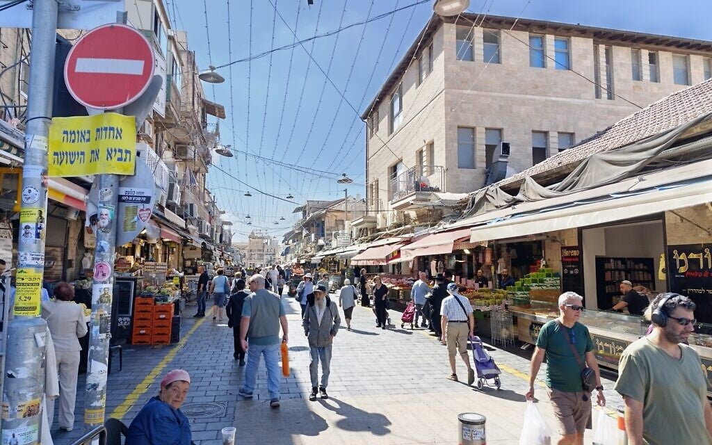 In Jerusalem market, hostage release and ceasefire inspire both optimism and anxiety