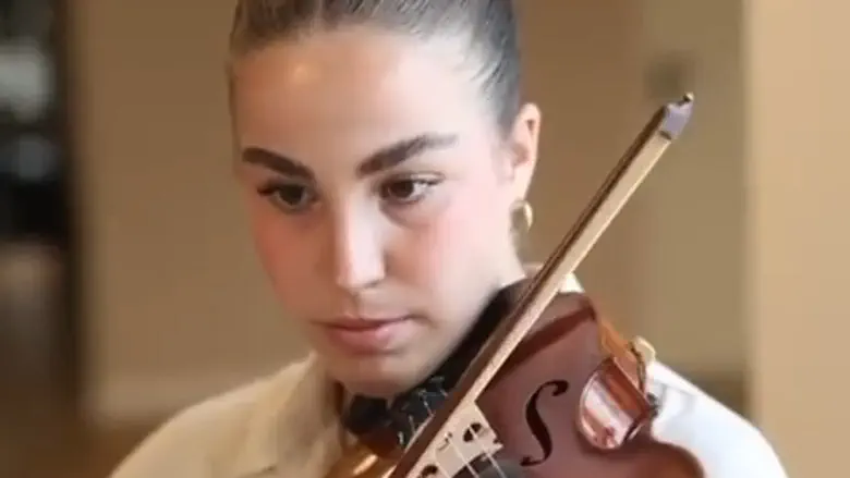 Watch: Captivity survivor Agam Berger plays ‘Hatikva’ at Berlin Jewish festival