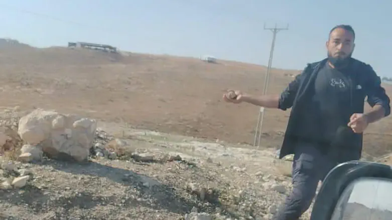 Injured resident documents terrorist throwing stone