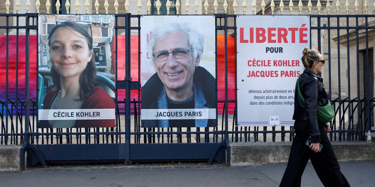 Iran releases two French nationals charged with espionage, Macron says