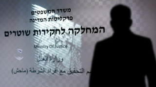 Senior police officer questioned in corruption probe, suspended from duty