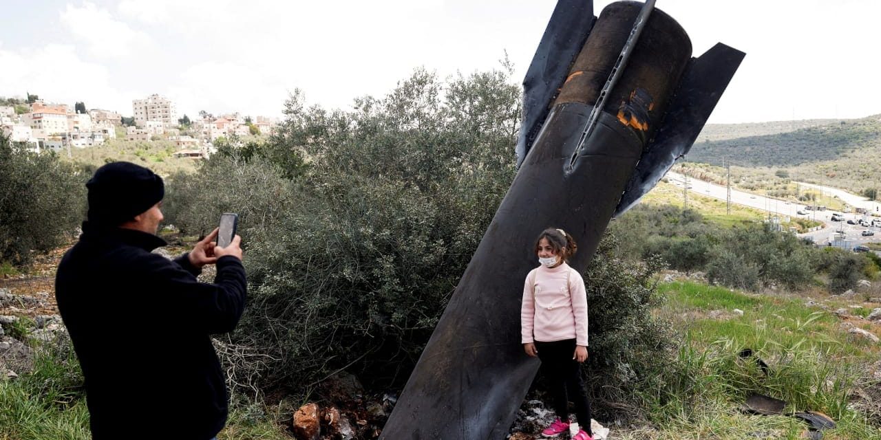 Huge Iranian missile fragments, intercepted by air defenses, lay scattered across Israel, West Bank