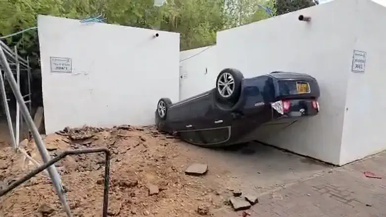 Aftermath: Car flipped and stopped by shelter; no injuries