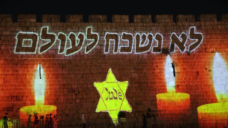 Jerusalem remembers: Yellow star, ‘We will never forget’ projected on Old City walls