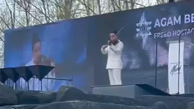 Former hostage Agam Berger performs solo violin piece at March of the Living