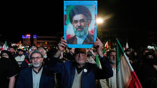 Iran sees mixed response to ceasefire as regime supporters rally in streets