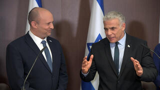 Bennett, Lapid announce dramatic move to merge parties ahead of elections