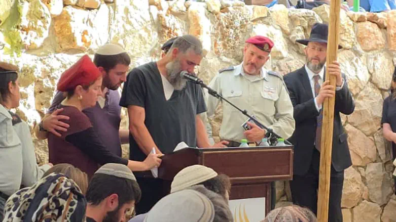 Bereaved father sings haunting song about sacrifice over son’s grave