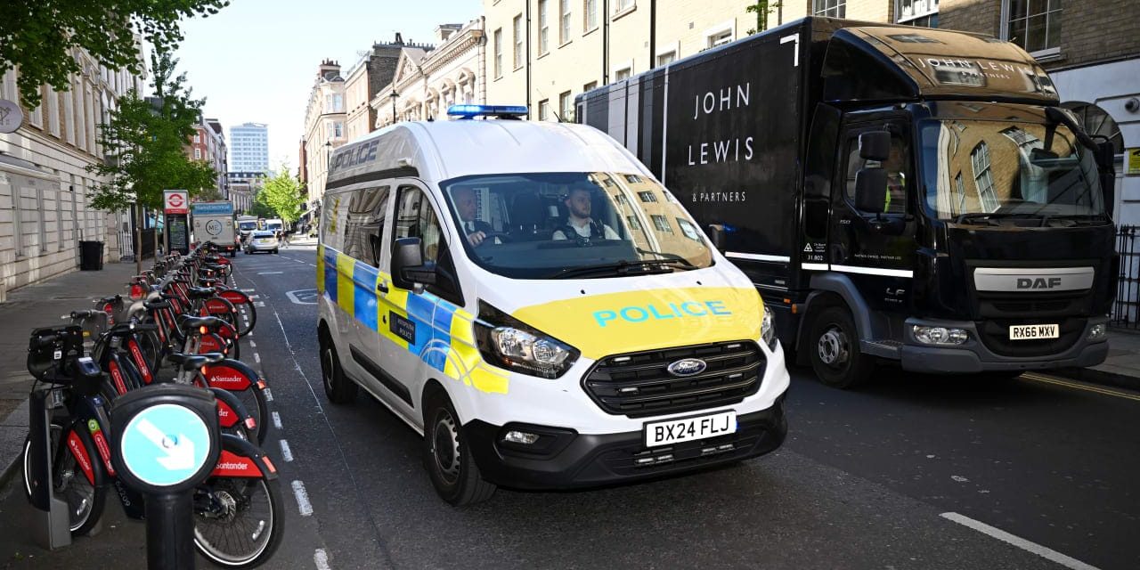 Two arrested over Golders Green Iranian memorial wall arson