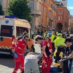 Driver hits 7 pedestrians in northern Italy, crashes into shop and stabs bystander