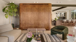 The safe room was stuck in this 1980s home; the redesign turned it into its boldest feature