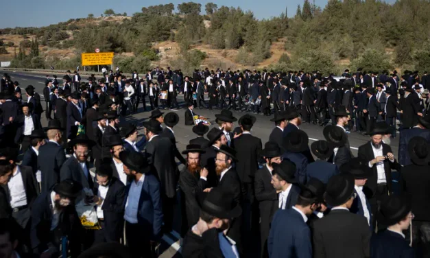 Haredi protesters paralyze trains and roads