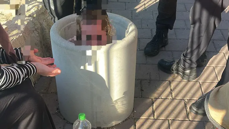 Game turns serious: Child finds himself stuck in concrete bin in Beitar Illit