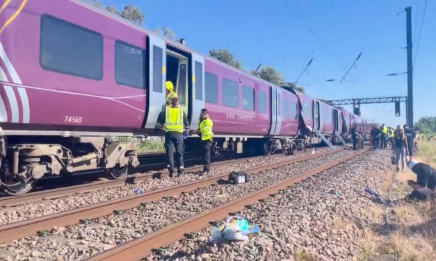 One killed and dozens injured in train collision north of London, police say
