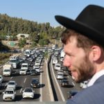 WATCH: Police arrest two suspected of pulling gun, threatening haredi protesters blocking Highway 1