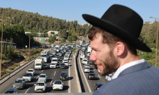 WATCH: Police arrest two suspected of pulling gun, threatening haredi protesters blocking Highway 1