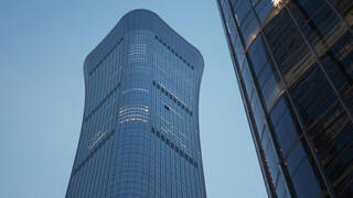 Small aircraft slams into Beijing’s tallest building