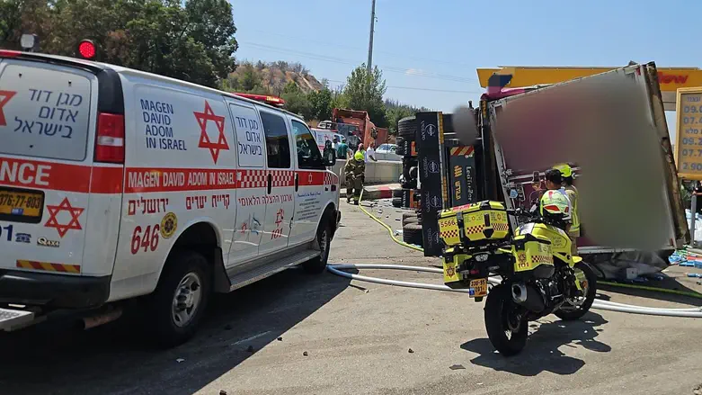 Truck plows into vehicles after overturning at gas station