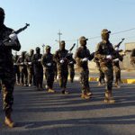 Iraq moves to rein in Iran-backed militias as coalition exits