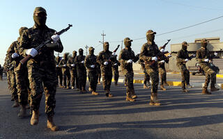 Iraq moves to rein in Iran-backed militias as coalition exits