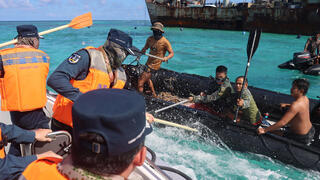 Watch: Chinese coast guard hits Philippine sailor in South China Sea clash