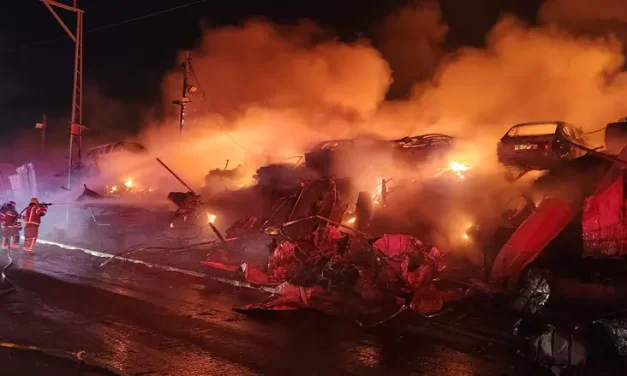 Firefighting crews battle blaze at vehicle lot in Kiryat Arba