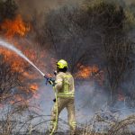 Fire threatens West Bank settlement, firefighters respond