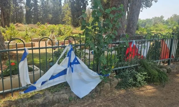 Israeli flags placed beside grave of fallen soldier torn, vandalized