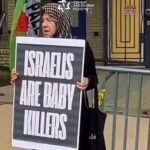 Anti-Israel protesters dump fake blood outside embassy in Washington, set up fake graves