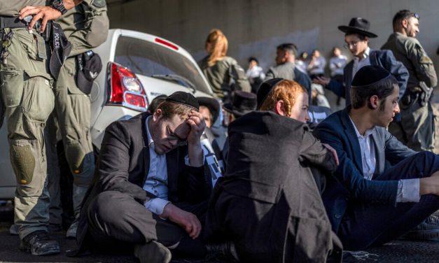 Dozens of ulra-Orthodox men block highway in West Bank after draft-dodger’s arrest