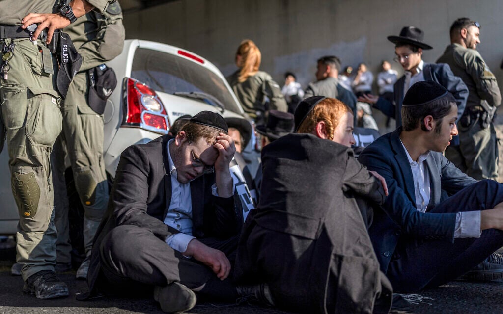 Dozens of ulra-Orthodox men block highway in West Bank after draft-dodger’s arrest