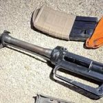 Doctor tries to hide M16, arrested after crashing into police car during chase | Watch